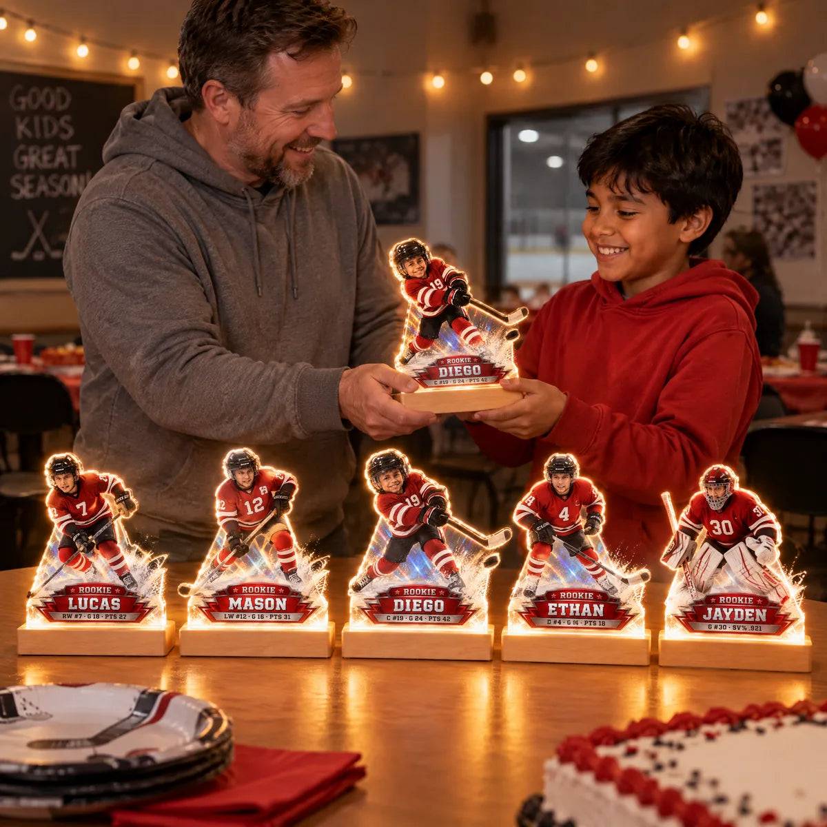 A coach hands out MVP Night Lights at the end-of-season party