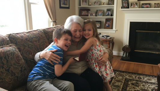 Two grandchildren hugging their grandmother on the couch in her living room, all three laughing