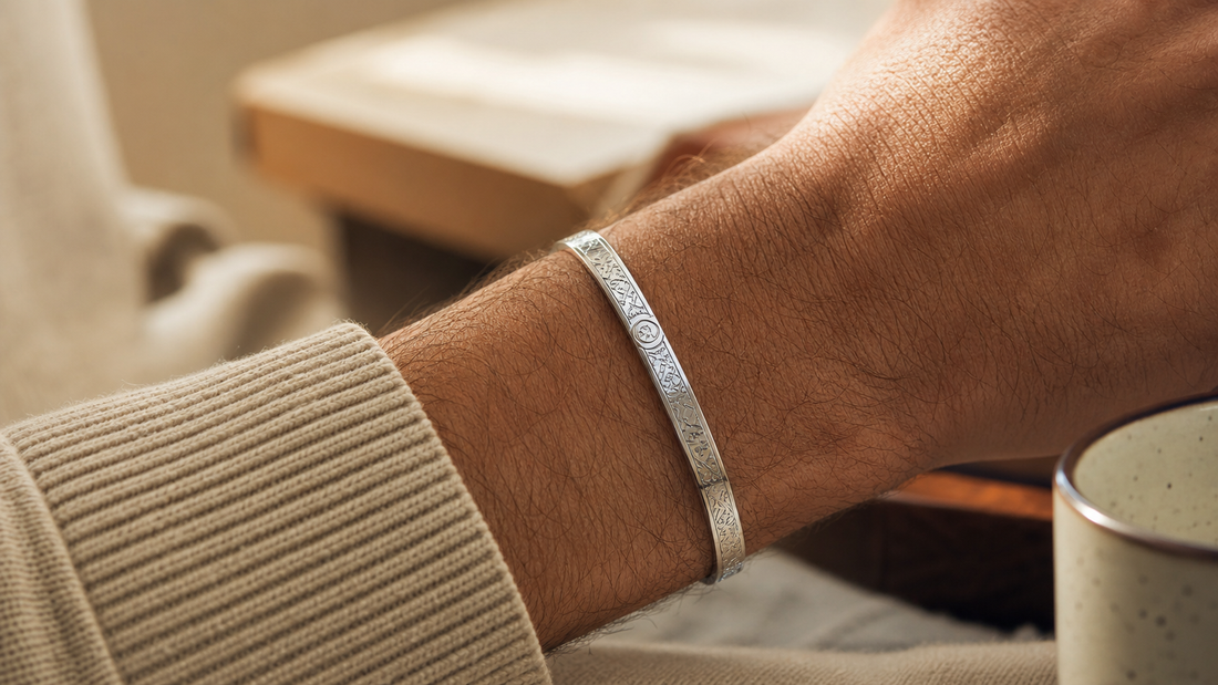 Close-up of a man wearing a meaningful engraved bracelet, symbolizing deep emotional connection and personal sentiment.
