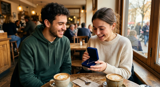 Young man surprising his girlfriend with a jewelry gift box at a sunny café