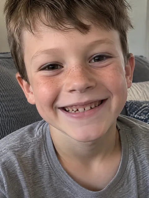 Example: a kid's face, close up and smiling