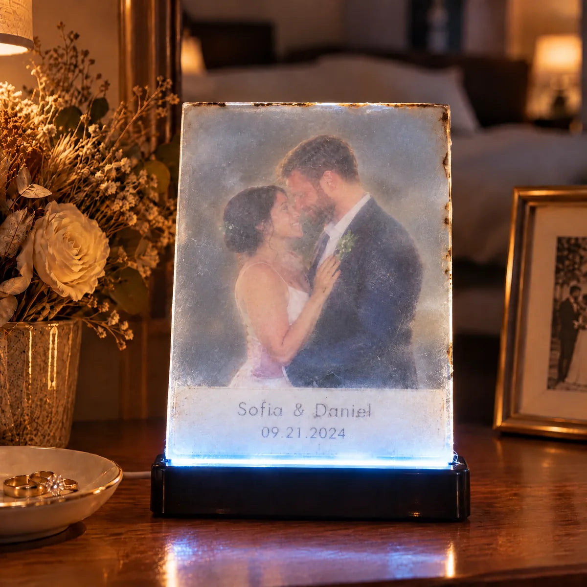 A cheap acrylic light: plain rectangle, cloudy plastic, faded print, plastic base